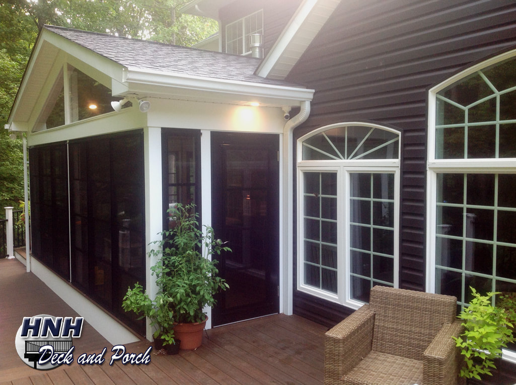 Low maintenance porch using WeatherMaster sliding panels window system by Sunspace.