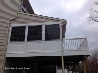Screened-in porch with Eze-Breeze sliding panels.