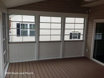 Screened-in porch with Eze-Breeze sliding panels.