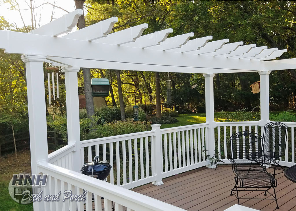 Deck with a white vinyl pergola