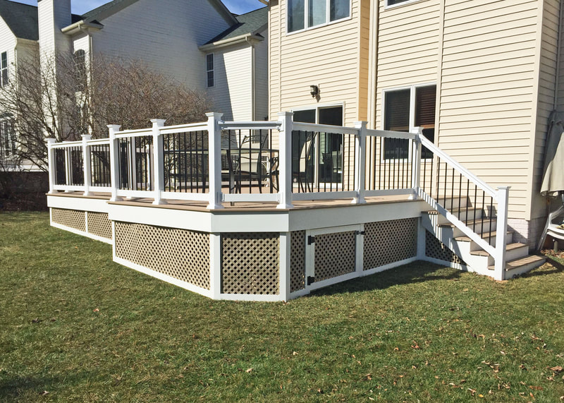 Deck with vinyl privacy Brownstone lattice with storage area