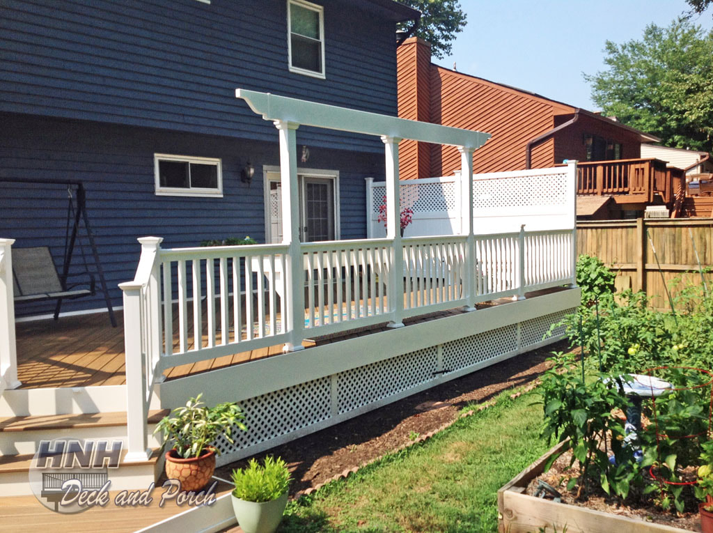 Deck with white vinyl privacy lattice and pergola