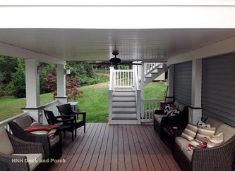 Vinyl deck using Wolf Tropical Hardwoods Collection PVC Decking with Rosewood flooring.