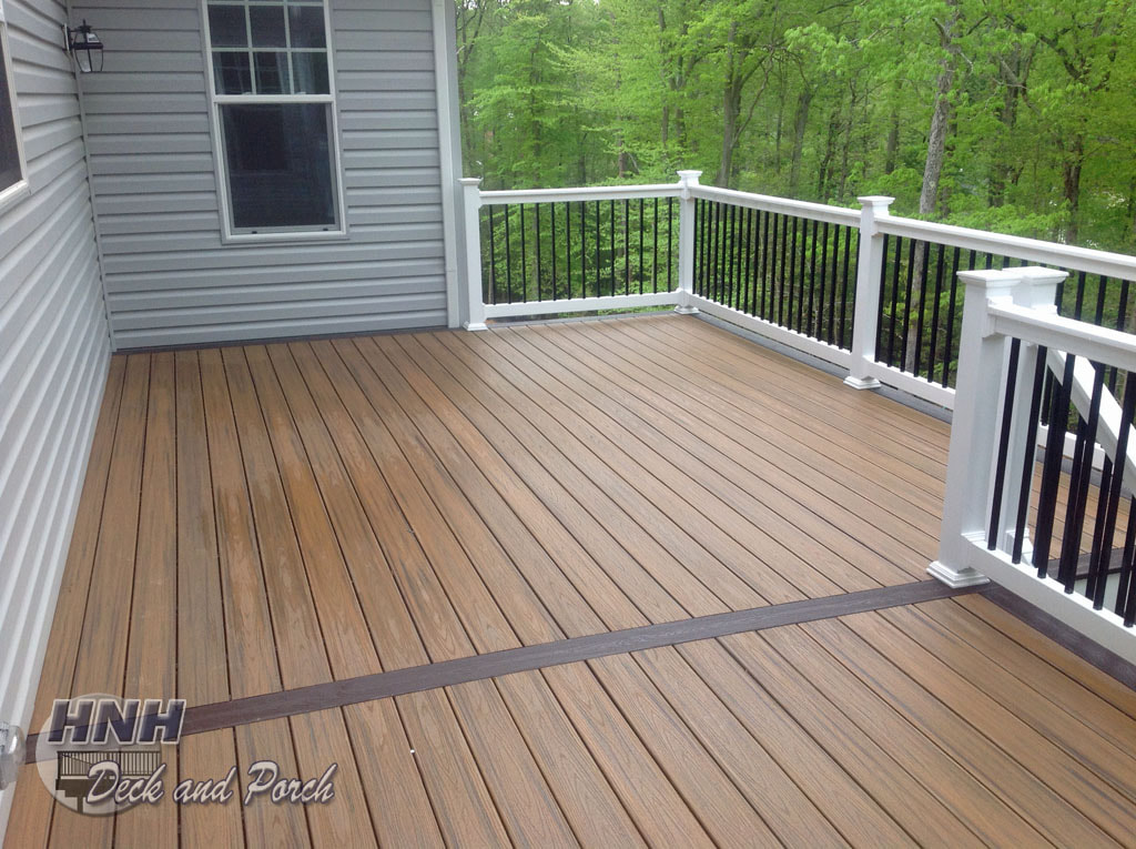 Trex decking, Havana Gold and Spiced Rum decking, white vinyl rail with black aluminum balusters