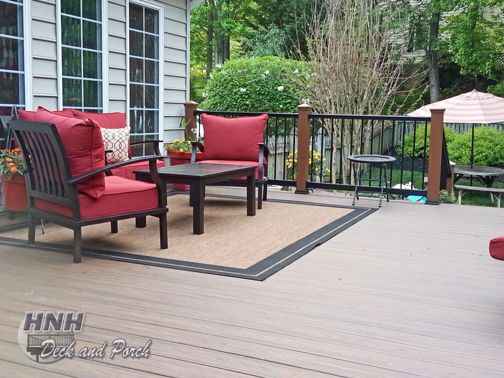 Trex Transcend Decking, Spiced Rum flooring, Tree House posts, and Superior Plastic black railing and balusters