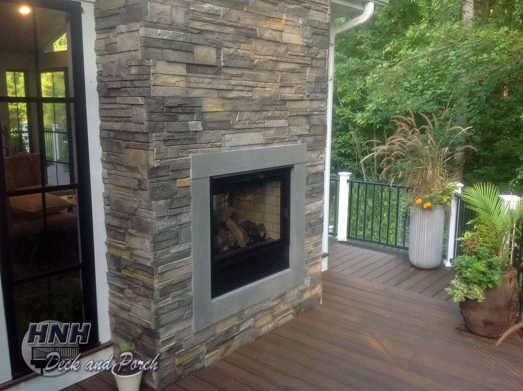 Deck and porch with twilight fireplace