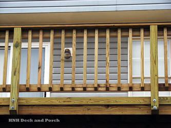 ACQ pressure treated pine wood deck and railing.