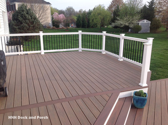 Vinyl Deck with Wolf PVC Decking Tropical Hardwoods Collection with Amberwood flooring and Rosewood border.