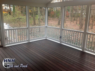 Low maintenance screened porch with Fiberon Horizon Composite Decking with Rosewood flooring.