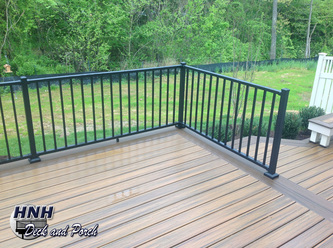 Composite deck with Westbury black aluminum railing and balusters.