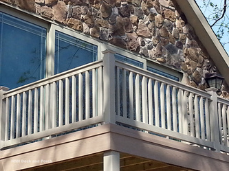 Azek PVC deck using tan vinyl railing and balusters by Longevity.