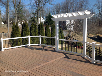 Vinyl deck using Wolf Tropical Hardwoods Collection PVC Decking with Amberwood flooring.