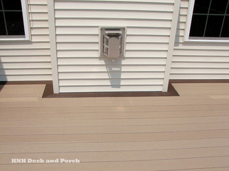 Deck using Azek PVC Decking Harvest Collection, Brownstone flooring and Kona border.